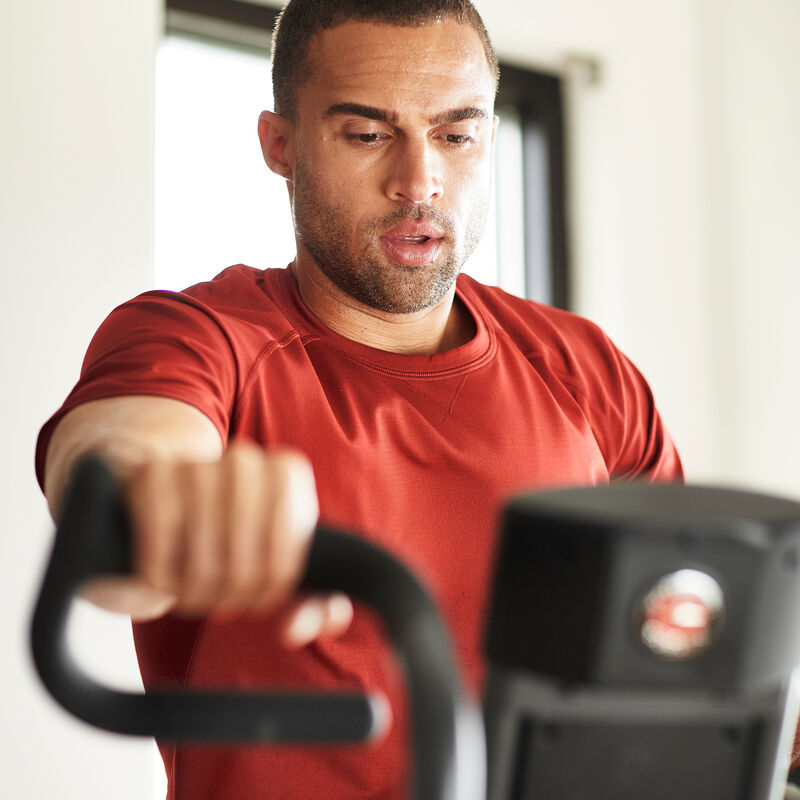 Man working out on on Airdyne AD7  - expanded view